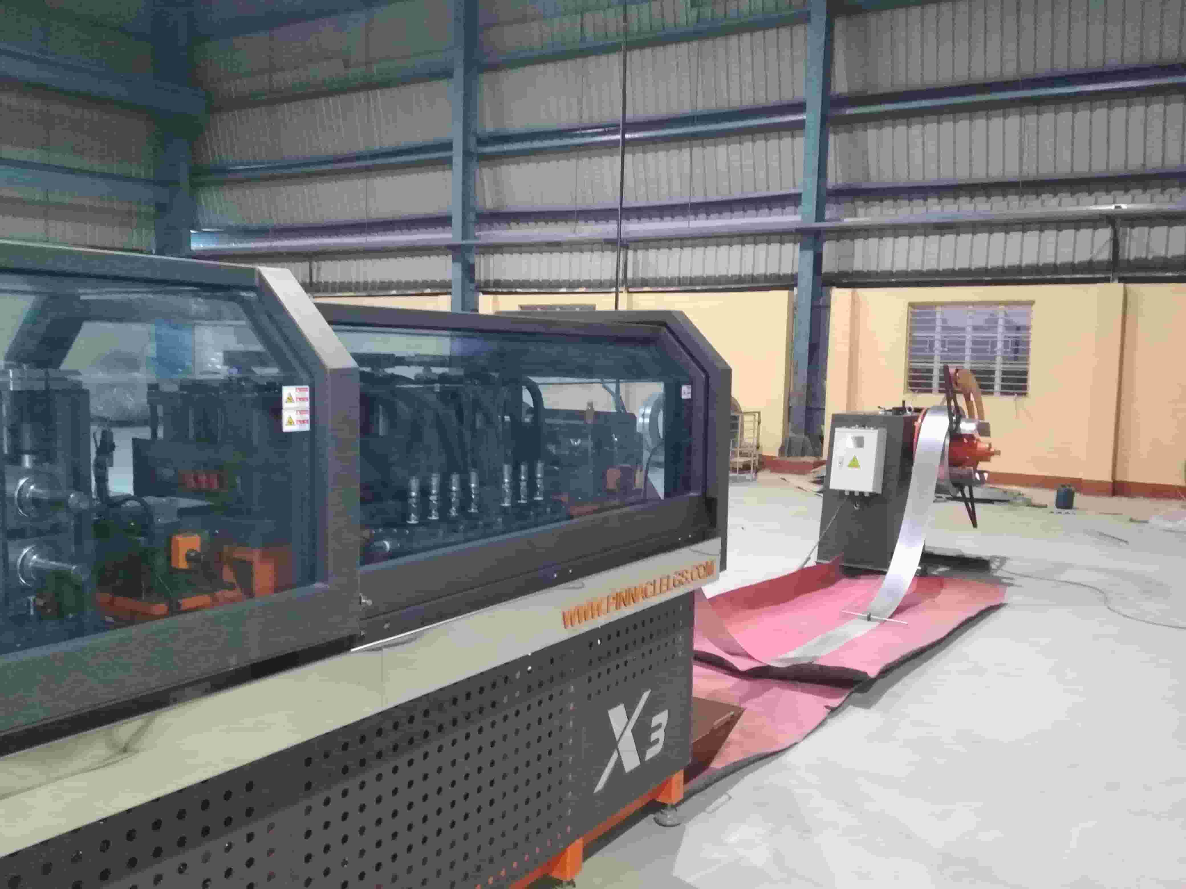 Roll-forming line with galvanised coil feeding in, producing light gauge steel framing sections at Jadro Steel's Howrah factory